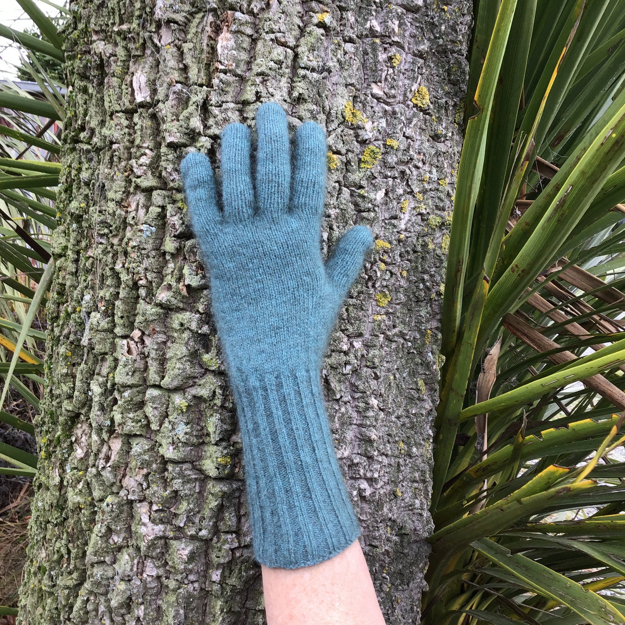 Shows how the glove can be worn with a long cuff.