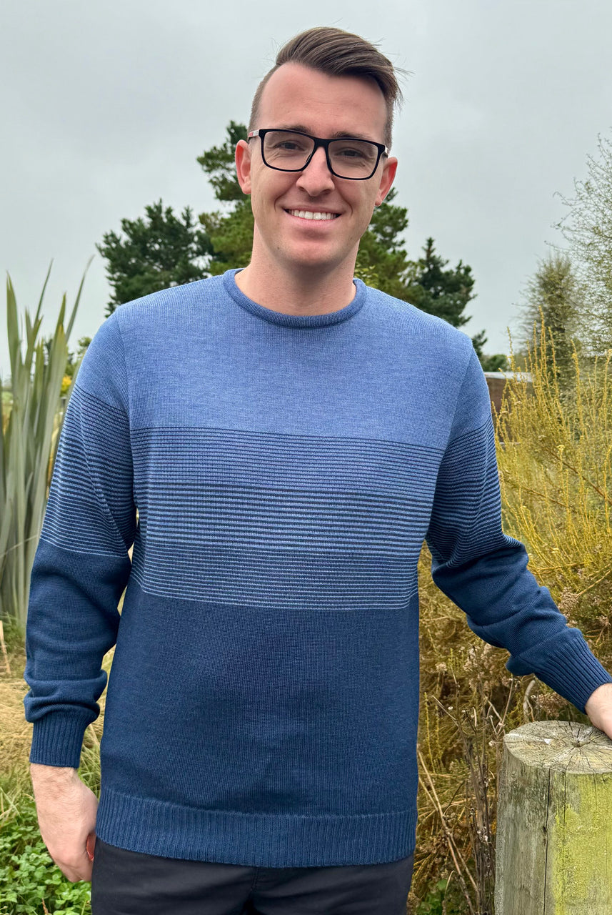 Man wearing the Country Laine - Mens Merino Midweight Graduated Stripe Crew in the colour Dark Indigo/Denim