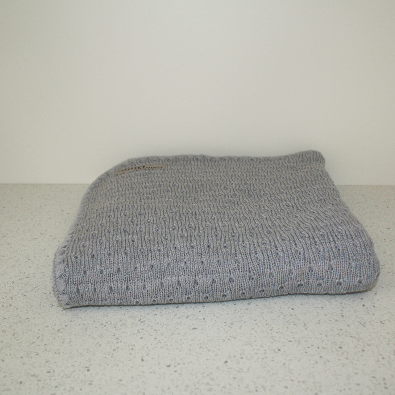 Grey coloured baby blanket.