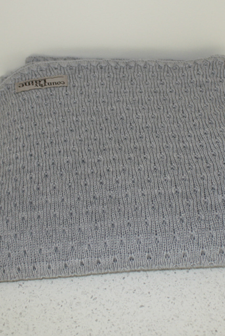 Grey coloured baby eyelet blanket.