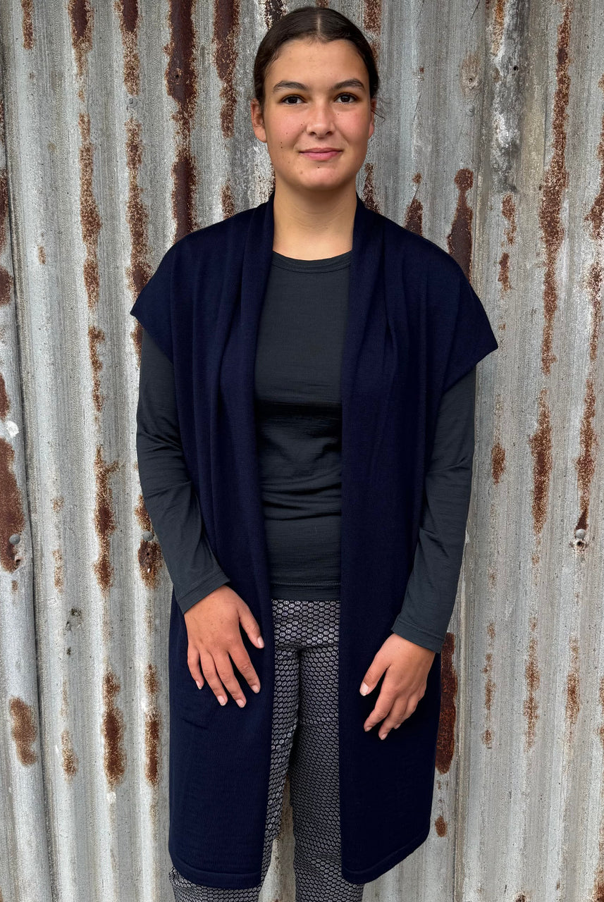Woman wearing Country Laine - Merino Longline Cap Sleeve Cardigan (CL069) in the colour Navy