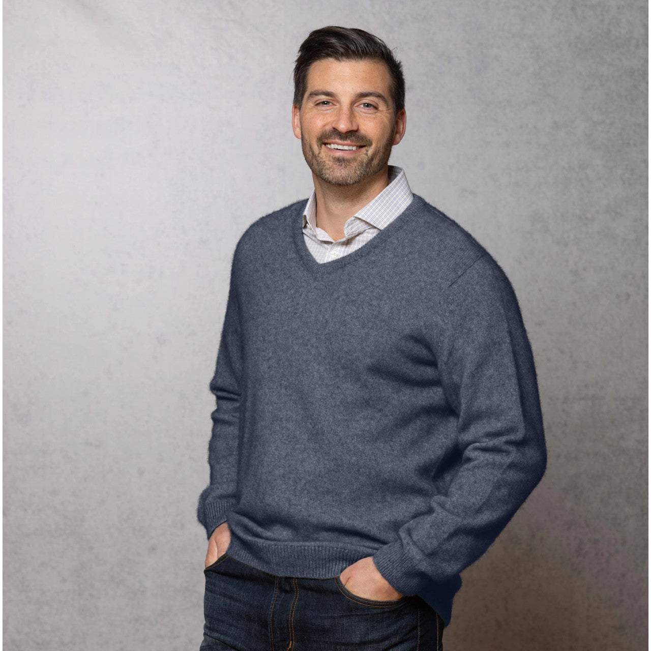 Man wearing the Noble Wilde - Merino & Possum Oxford Vee Sweater (NW1002) in the colour Neptune.