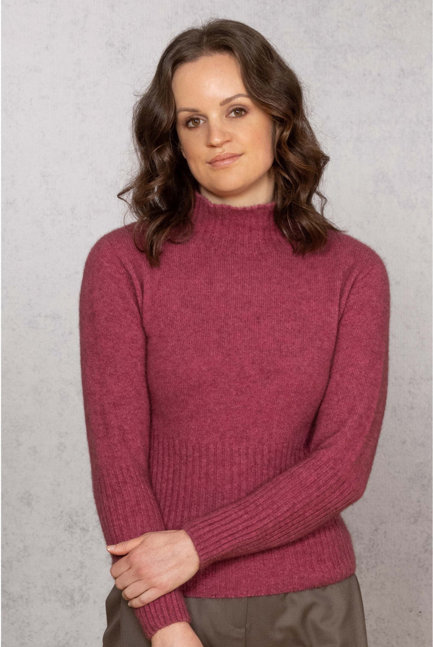 Woman wearing Noble Wilde - Merino & Possum Rib Turtle Sweater (NW3063) in the colour Rosay.