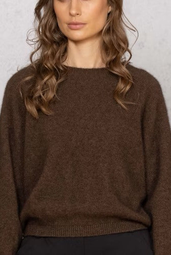 Woman wearing Noble Wilde - Merino & Possum Bellow Sleeve Top in the colour Tobago.