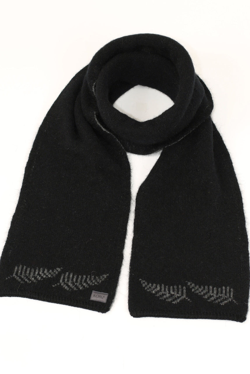 A black Koru merino and possum NZ Supporters Silver Fern Scarf.