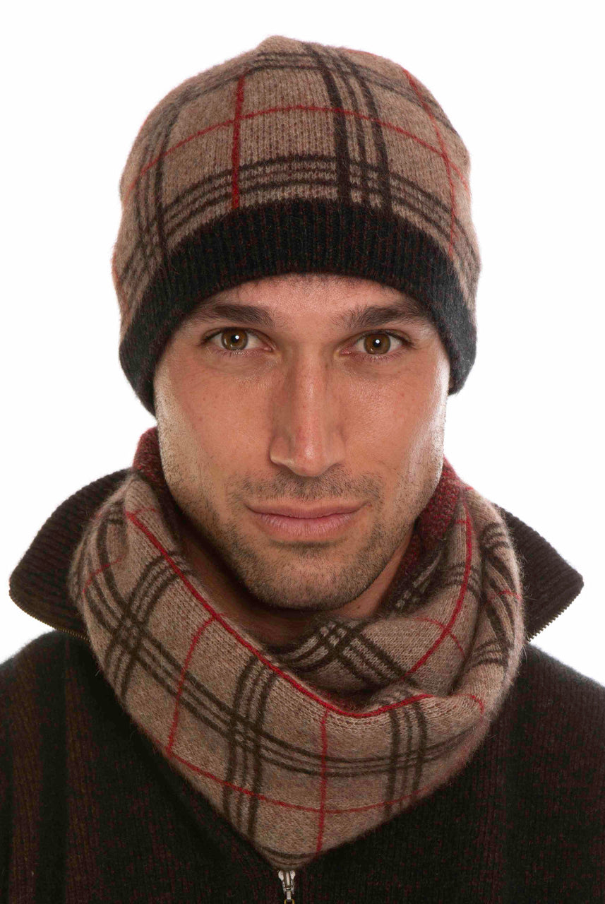 A man wearing a mocha, espresso, and rata-coloured Koru merino and possum Tartan Scarf.
