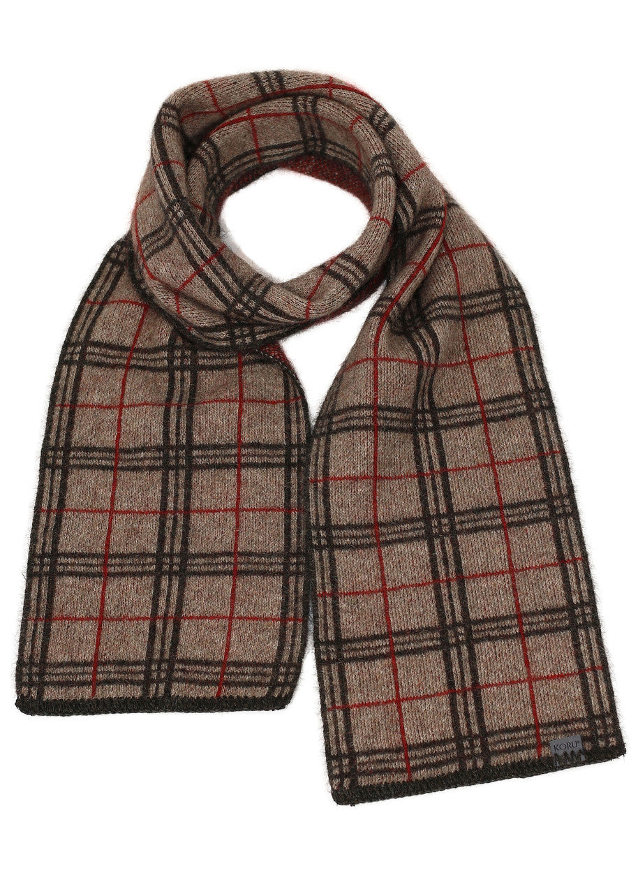 A mocha, espresso, and rata-coloured Koru merino and possum Tartan Scarf.