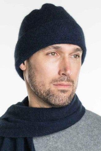 A man wearing an Navy-coloured Koru Merino and Possum Plain Beanie.