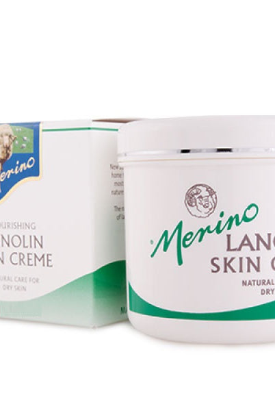 Merino 100g Lanolin Skin Crème with branding next to its packaging box.