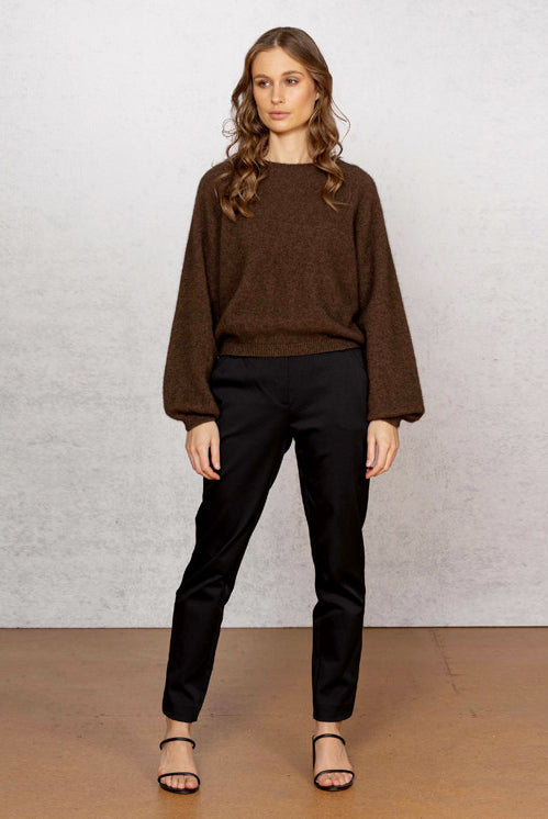 Woman wearing Noble Wilde - Merino & Possum Bellow Sleeve Top in the colour Tobago.
