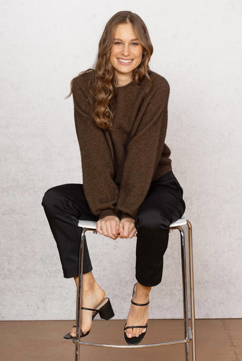 Woman wearing Noble Wilde - Merino & Possum Bellow Sleeve Top in the colour Tobago.