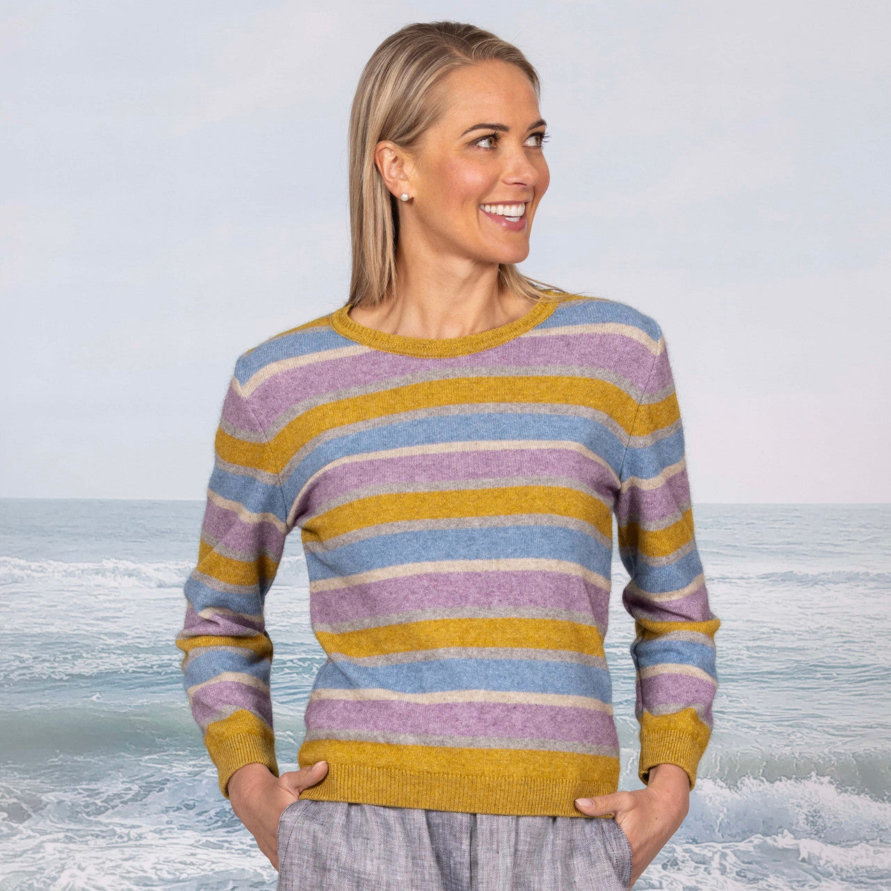 Woman wearing the Cara Crew in the colour Ochre Base.