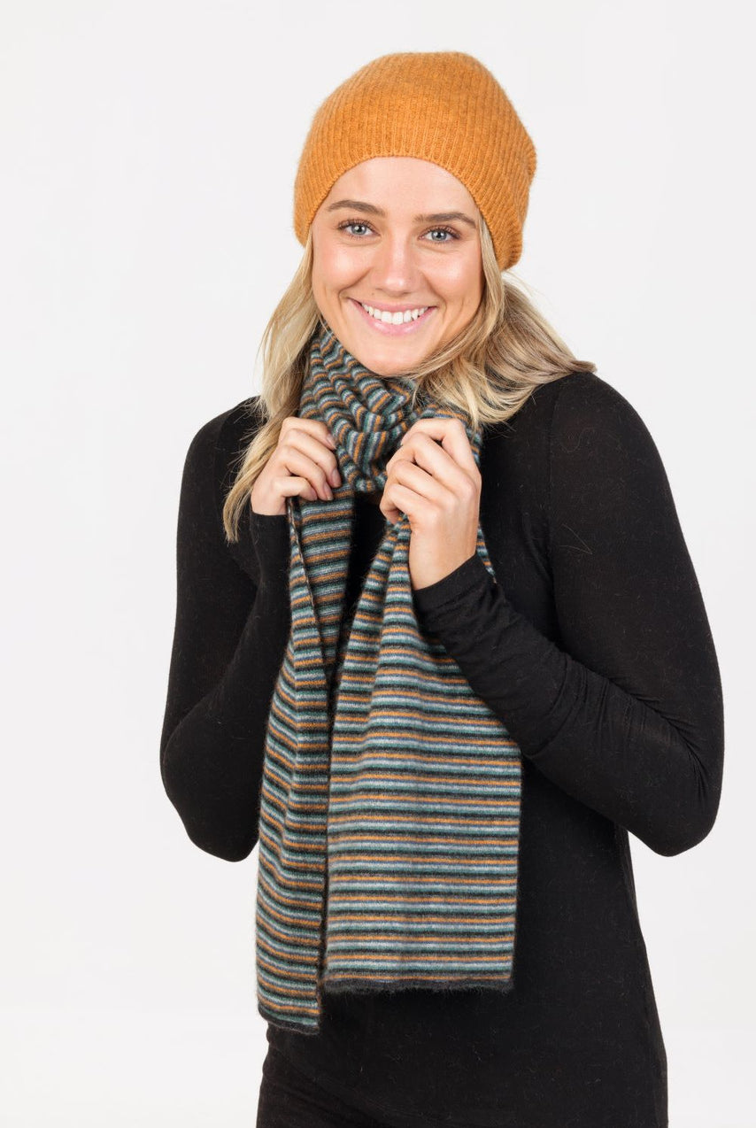 Woman wearing Native World - Merino & Possum Six Colour Scarf (NX894) in the colour combination Charcoal.