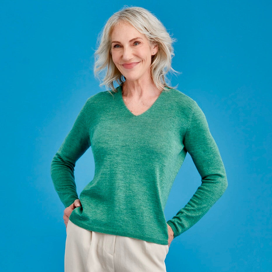 Woman wearing Royal Merino - Long Sleeve Classic High Vee (RM2050HV) in the colour Green Tea.