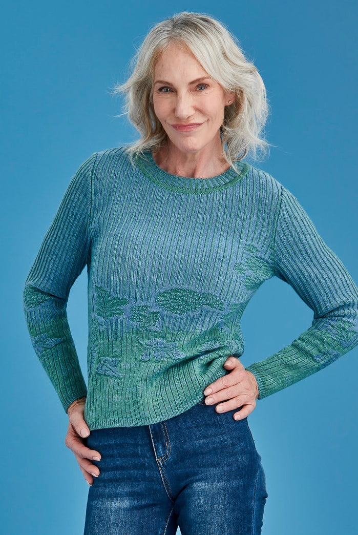 Woman wearing Royal Merino - Flourish Jumper (RM3037) in the colour Green Tea/Cornflower