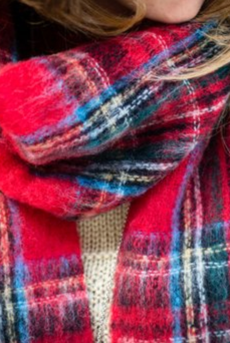 Person wearing Alpaca fur scarf in Royal Stewart