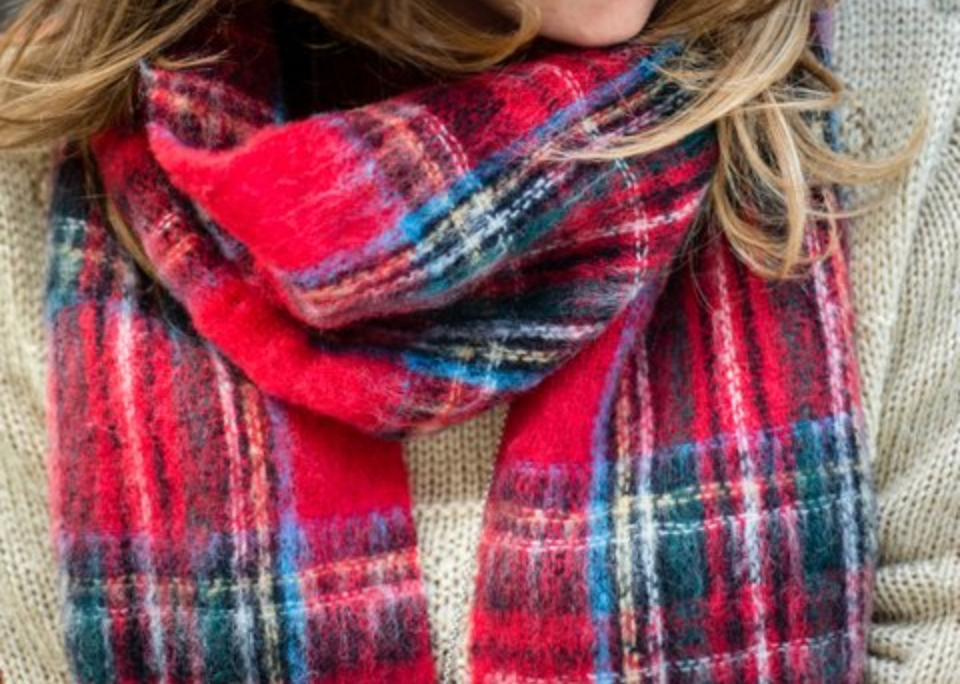 Person wearing Alpaca fur scarf in Royal Stewart