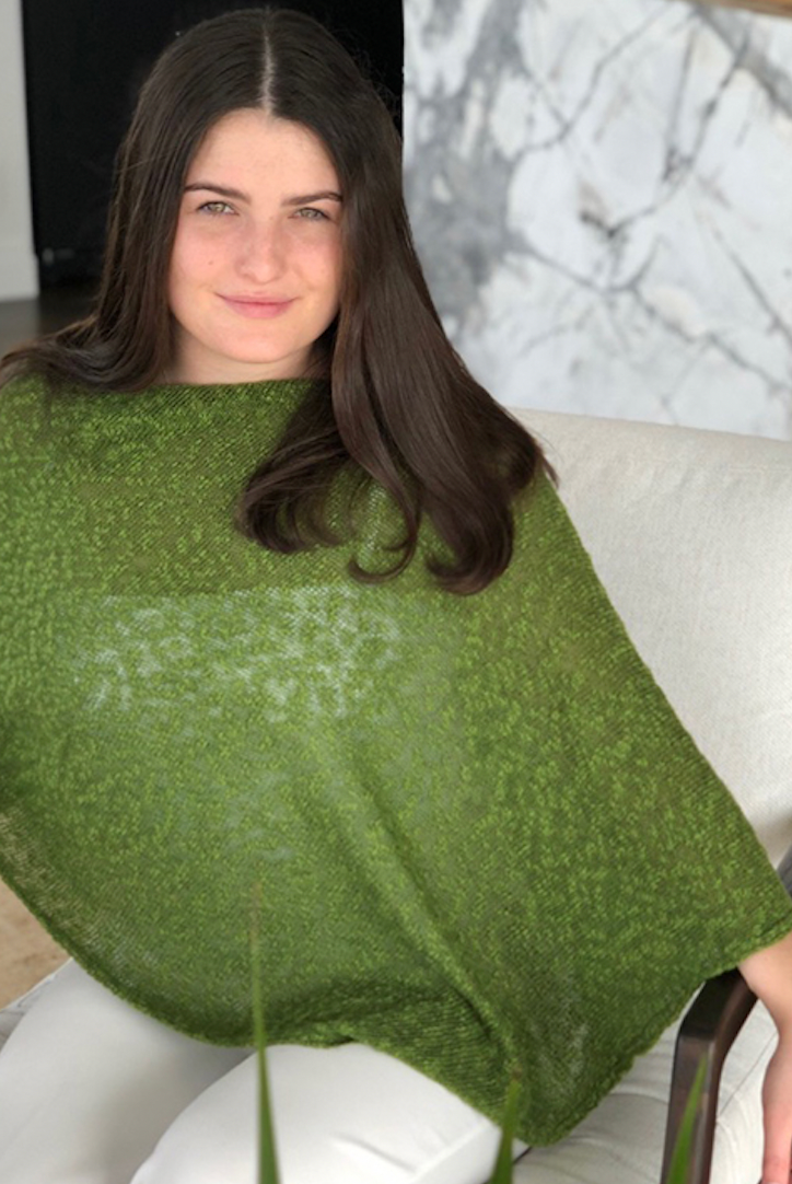 Woman wearing cotton poncho. Colour Fern