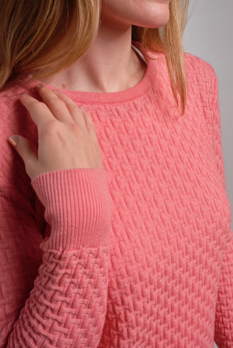 Close up of woman wearing Country Laine - Merino Basketweave Jumper (CL0057) in the colour Peach.