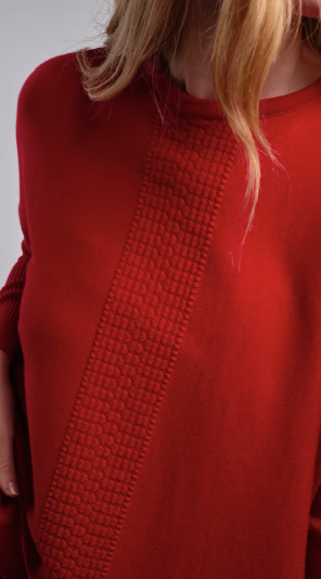 Woman wearing Country Laine - Merino Swing Jumper (CL0075) in the colour Blood Red.