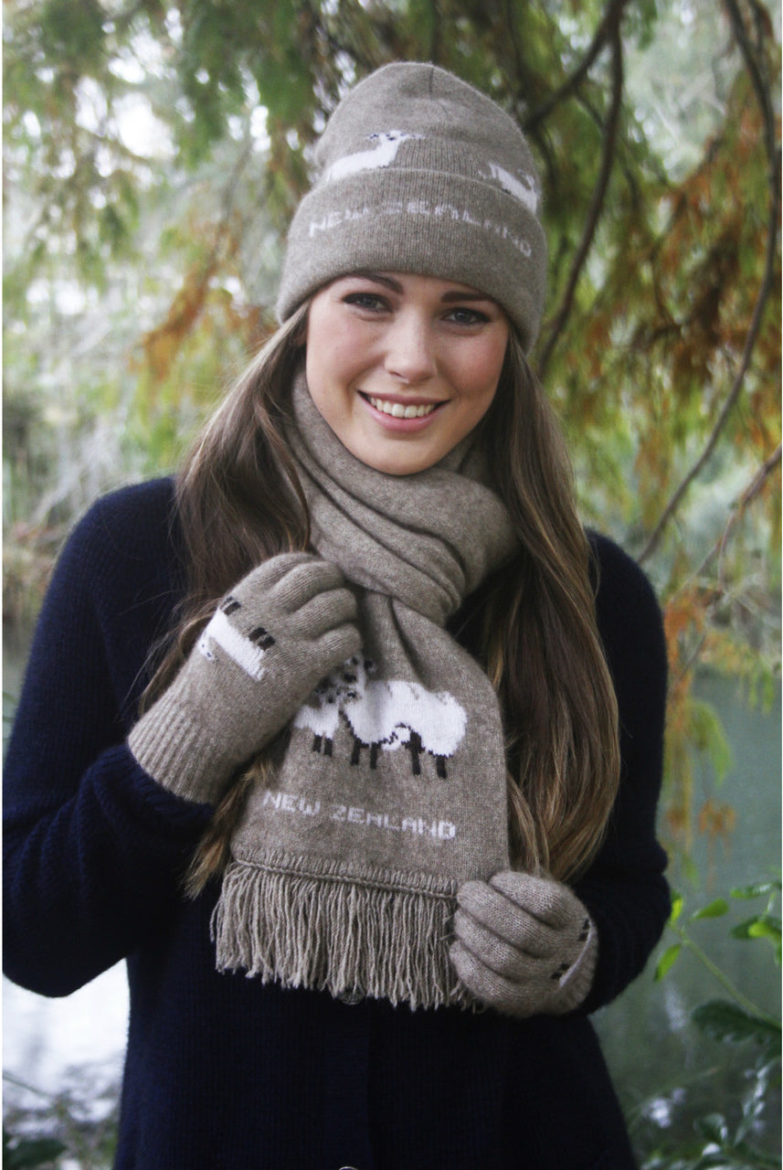 Woman wearing scarf with sheep detailing