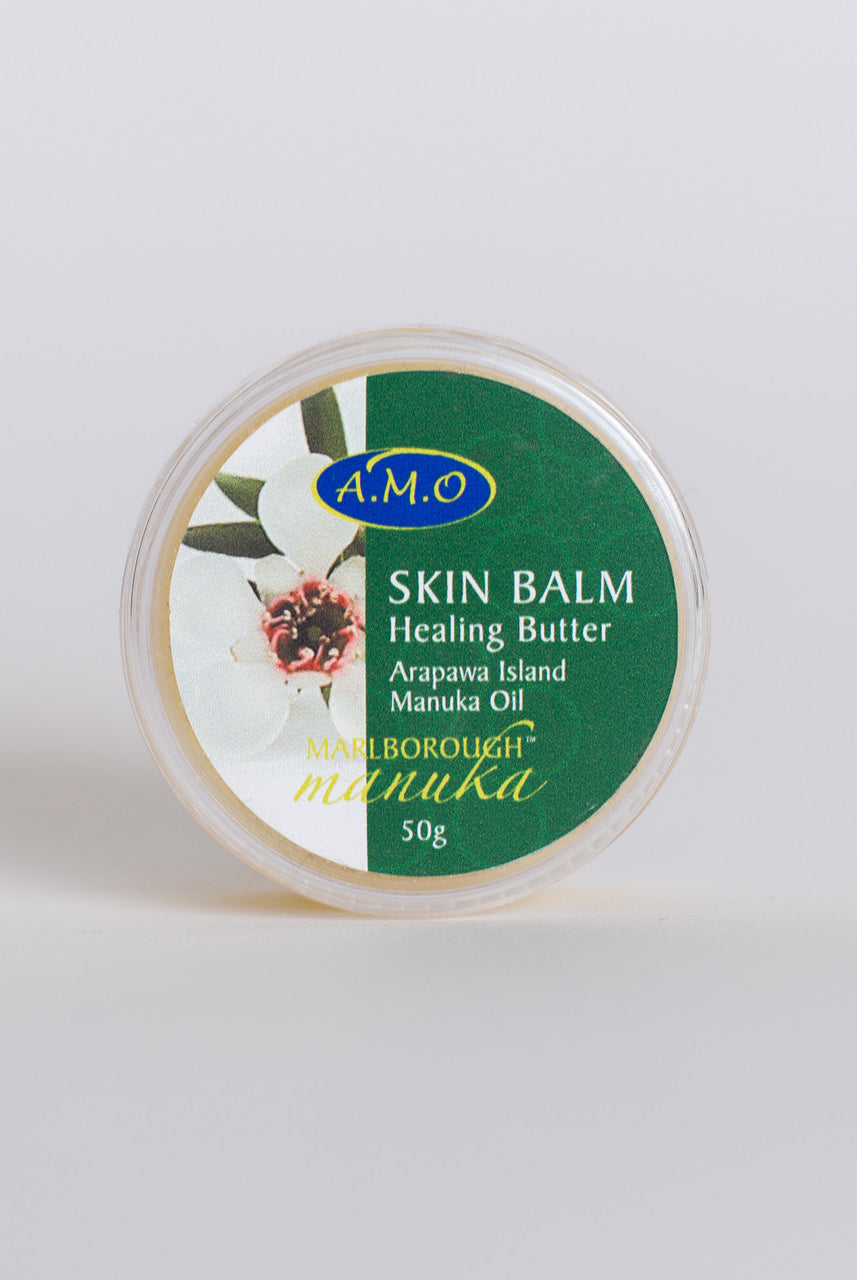 50g Pot of skin balm. Green and white label with Manuka flower on it.