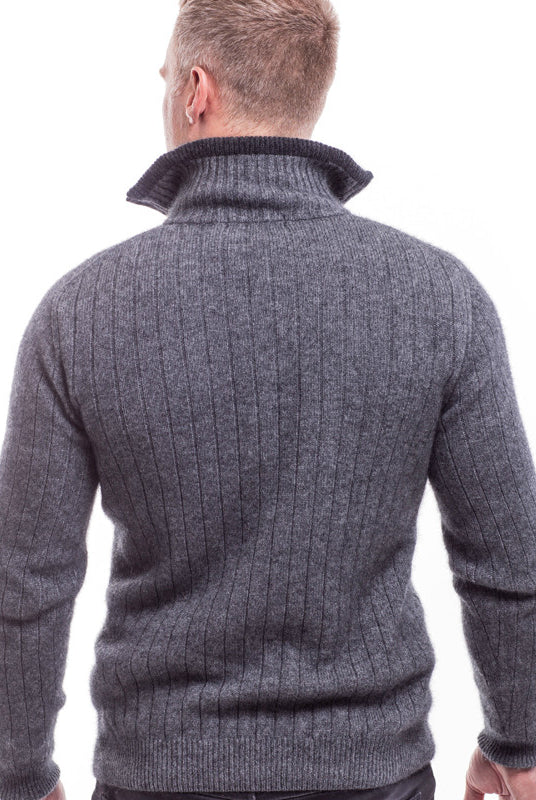 Back view. Male model wearing cable jersey. Grey and black.