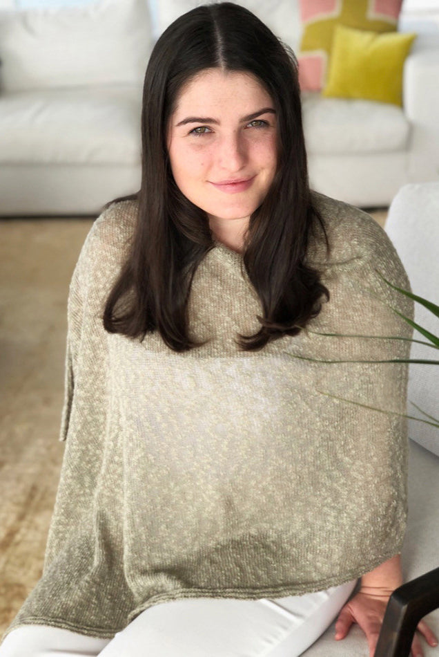 Woman wearing cotton poncho. Colour Stone