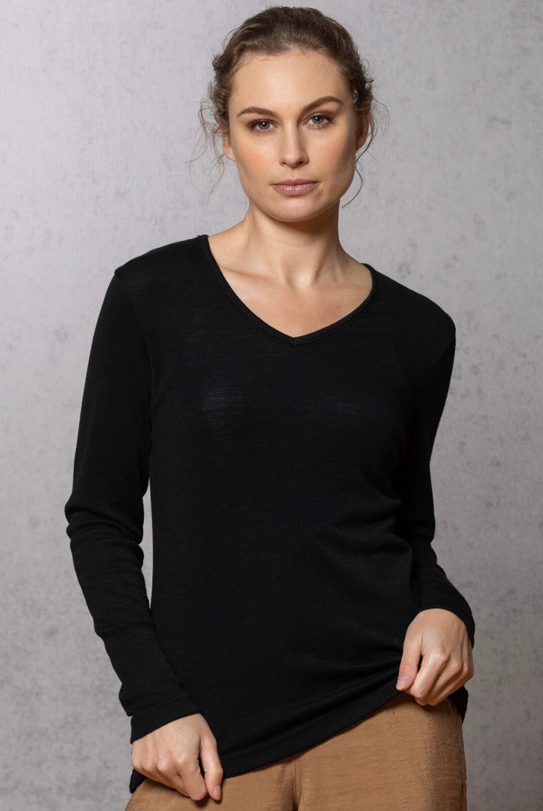 Woman wearing vee neck top in colour Black
