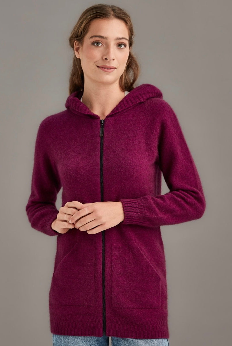 Woman wearing McDonald - Merino & Possum Stepped Stitch Hoodie (5063) in the colour Berry.