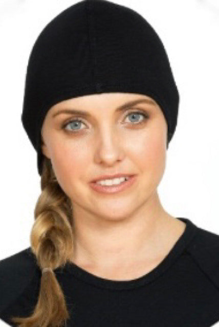 Woman wearing Merino wool black beanie.