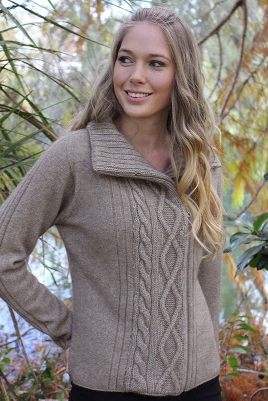 Woman wearing cable jacket in colour Natural