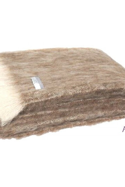 Folded Alpaca fleece throw in Pumice colour.