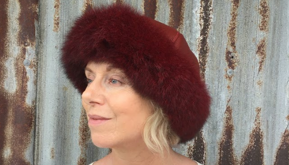 Woman wearing a Red Four Peaks Classic Panelled Lambskin & Possum Fur Hat.