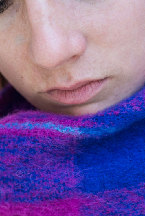 Woman wearing Alpaca fur scarf in Fuchsia Check