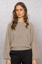 Woman wearing Noble Wilde - Merino & Possum Bellow Sleeve Top in the colour Oyster.