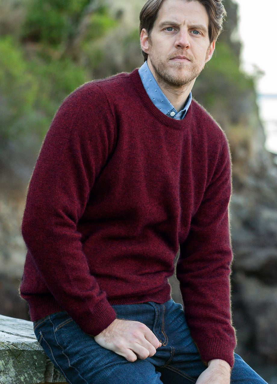 Man wearing the Noble Wilde - Merino & Possum Cambridge Crew Sweater (NW1001) in the colour Port.