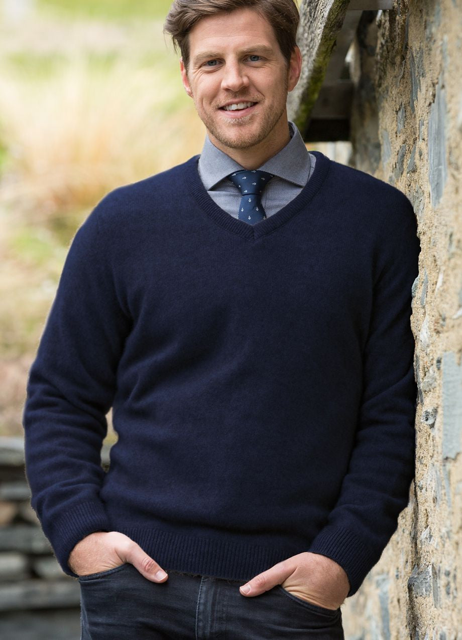 Man wearing the Noble Wilde - Merino & Possum Oxford Vee Sweater (NW1002) in the colour Maritime.