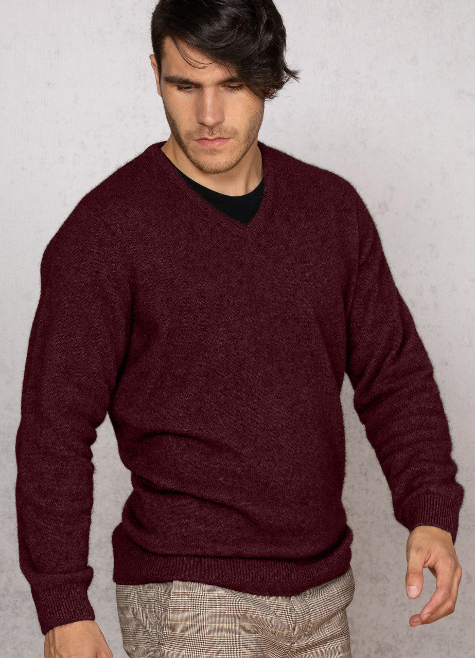 Man wearing the Noble Wilde - Merino & Possum Oxford Vee Sweater (NW1002) in the colour Port.