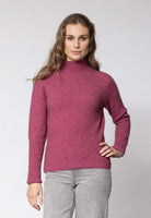 Woman wearing Noble Wilde - Merino & Possum Rib Turtle Sweater (NW3063) in the colour Rosay.