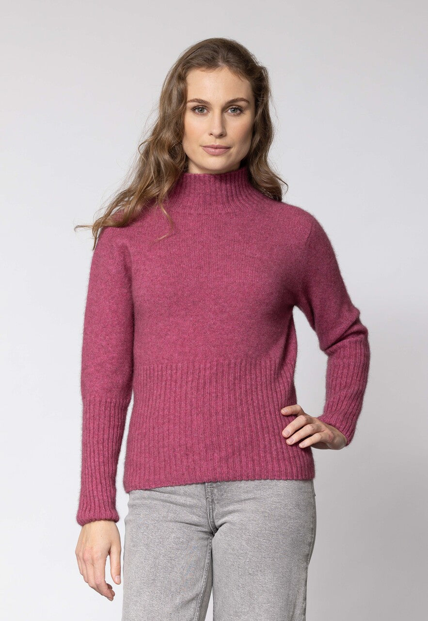 Woman wearing Noble Wilde - Merino & Possum Rib Turtle Sweater (NW3063) in the colour Rosay.