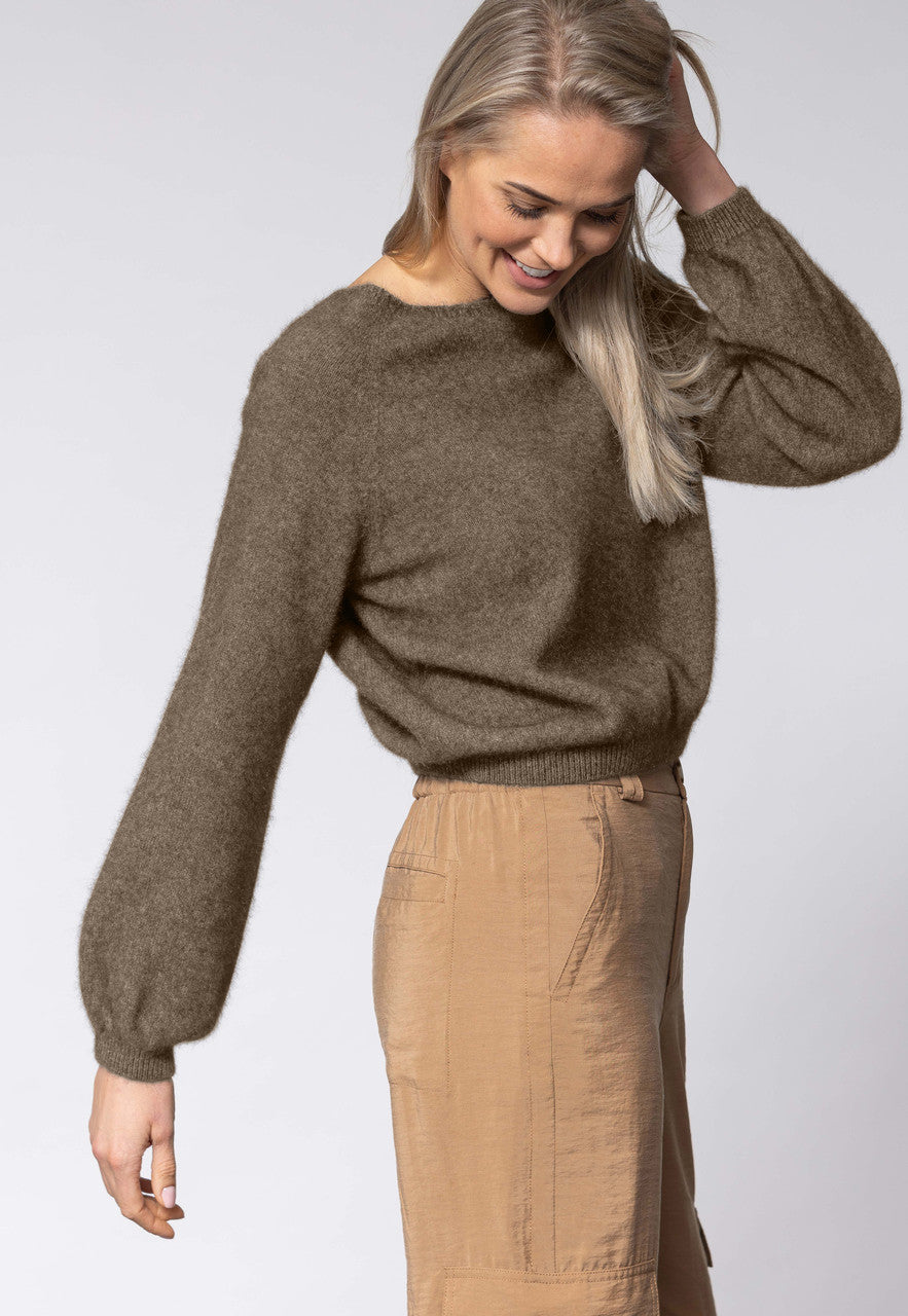 Woman wearing Noble Wilde - Merino & Possum Bellow Sleeve Top in the colour Latte.