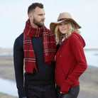 Couple wearing Red hoodie and checkered scarf