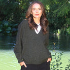Woman wearing the Lothlorian - Merino & Possum Cavern V Neck Jumper (9789) in the colour Moss.