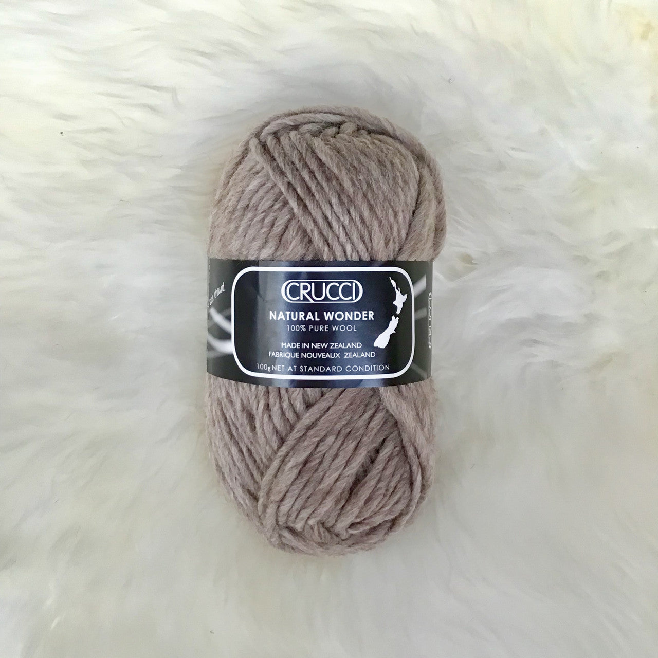 Ball of yarn in colour light brown.
