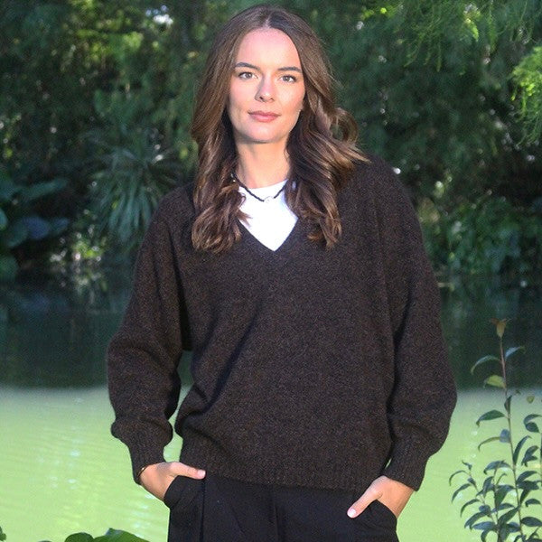 Woman wearing the Lothlorian - Merino & Possum Cavern V Neck Jumper (9789) in the colour Brown Marl.