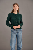 Woman wearing McDonald - Merino & Possum Patchwork Cardigan (5062) in the colour Forest.