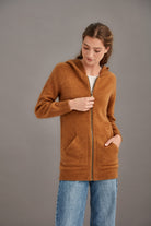 Woman wearing McDonald - Merino & Possum Stepped Stitch Hoodie (5063) in the colour Honeycomb.