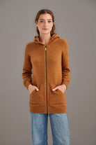 Woman wearing McDonald - Merino & Possum Stepped Stitch Hoodie (5063) in the colour Honeycomb.