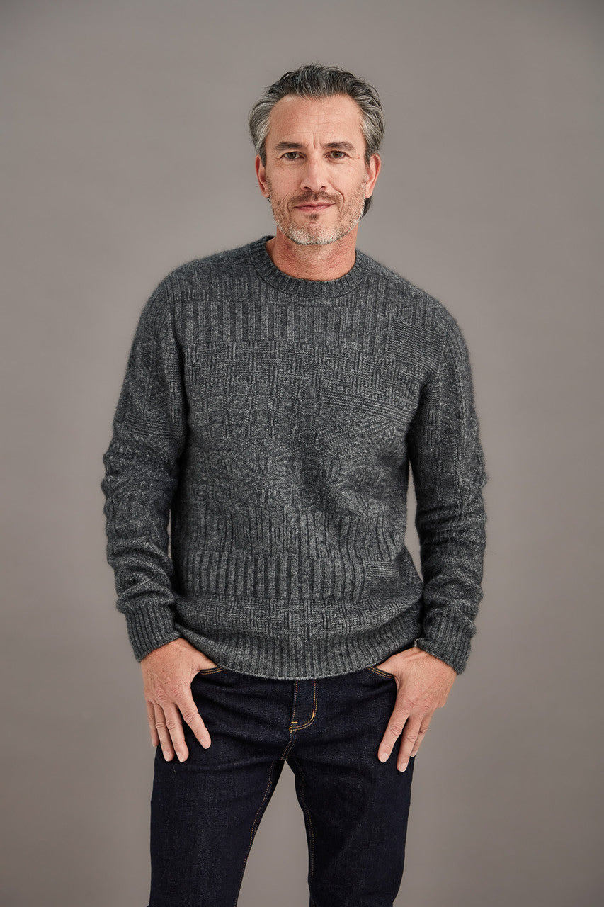 Man wearing McDonald - Merino & Possum Patchwork Sweater (6641) in the colour Pewter